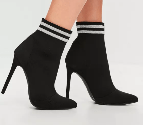 Black pointed boots with white stripes at ankle