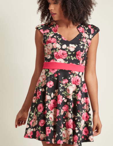 Dark floral spring dress with pink belt at the waist