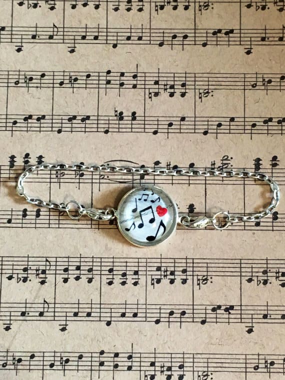 Bracelet with glass charm and musical notes 