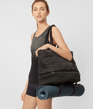 Girl holding canvas tote bag as gym bag