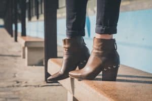 Detail of ankle boots in a metro station