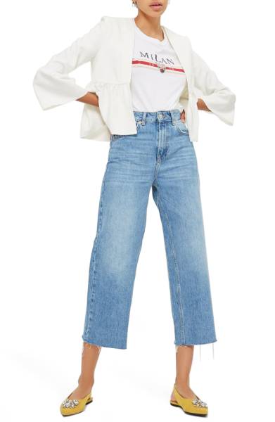 White cropped jacket pairs with cropped denim