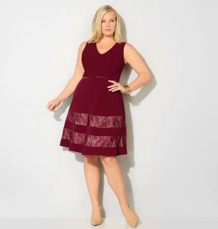 Blond model wearing red fit and flare dress with lace