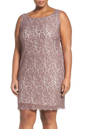 Model wearing plus-size, sleeveless lace dress