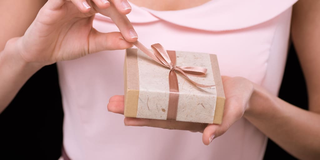 Woman opening a gift