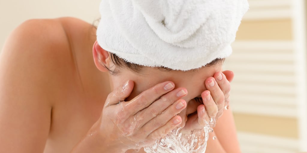 Woman washing her face 