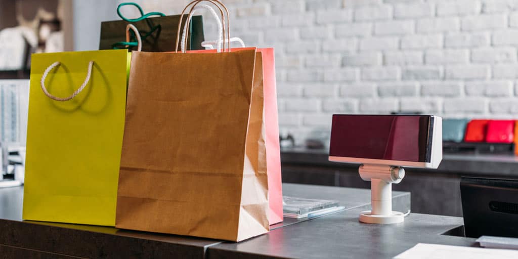 Retail store with shopping bags on the counter