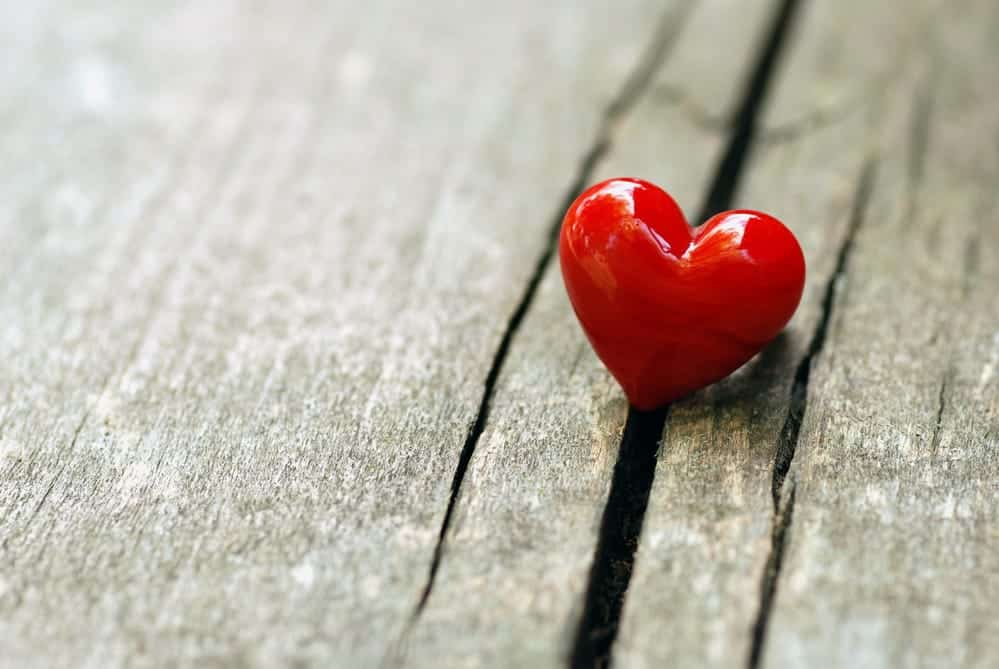 Red heart on a wood background